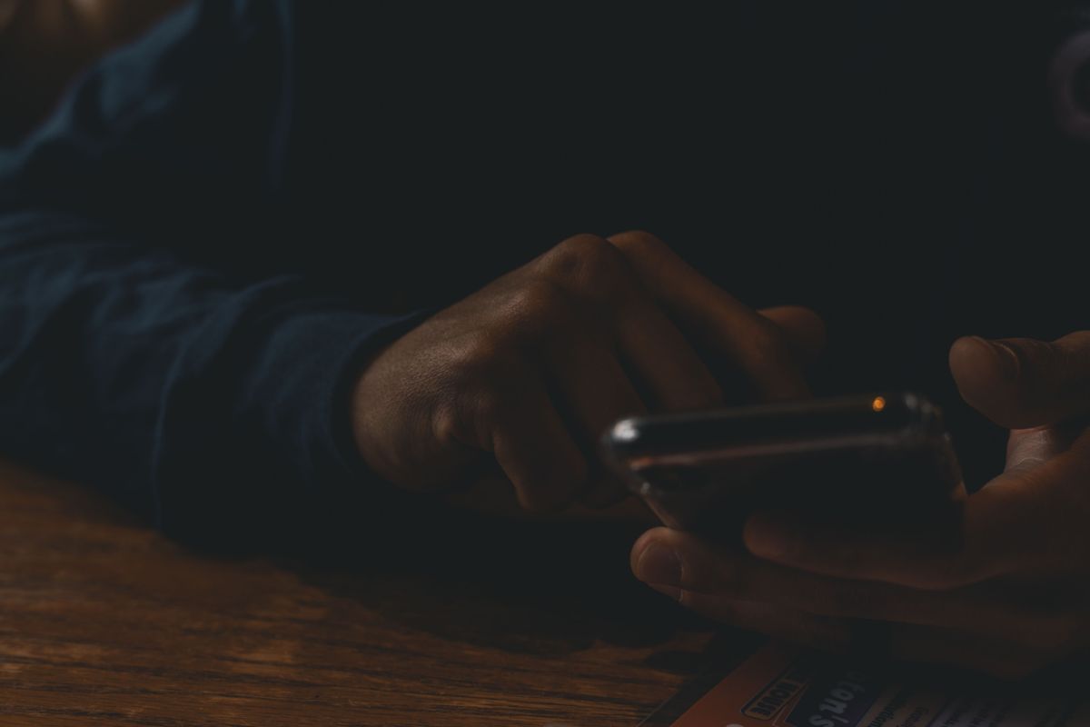 A person scrolling on a smartphone screen
