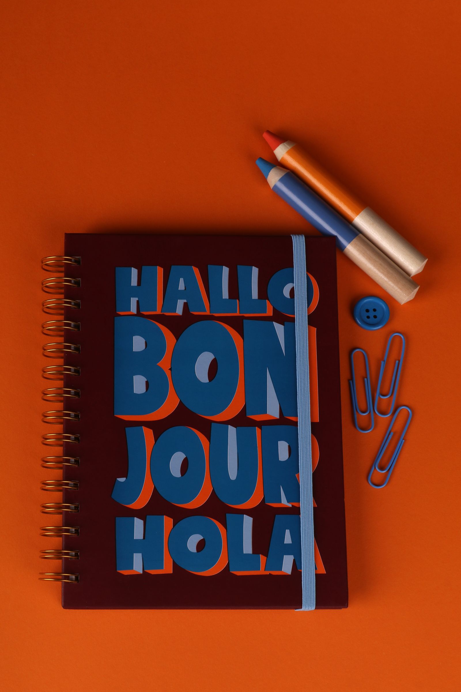 Spiral notebooks with covers spelling hello in several languages
