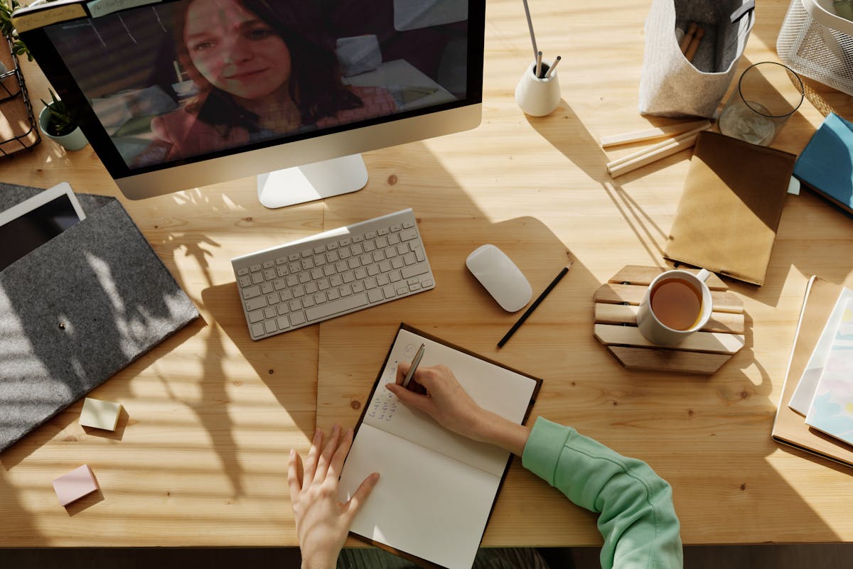 Student writing an essay at a desk