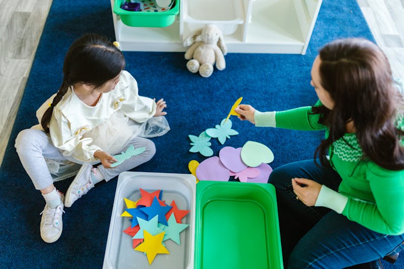 Parent and child working together with hands-on learning tools