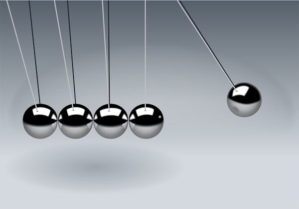 Newton's cradle demonstrating physics concepts for CK-12 Physics FlexBook