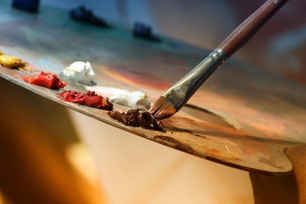 Paint brushes and art supplies for exploring great artists