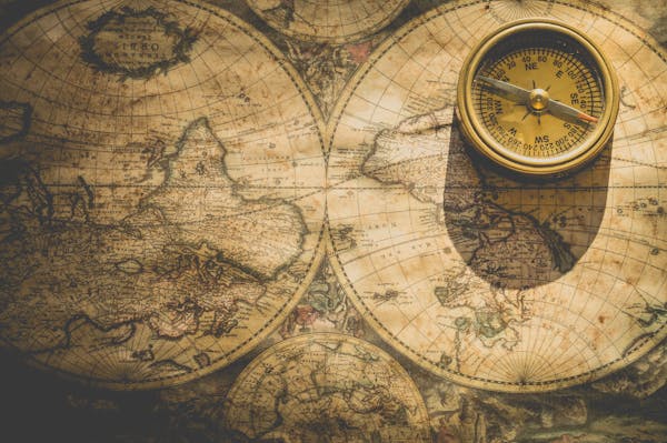 Antique compass and map representing the Age of Exploration in Story of the World Volume 3